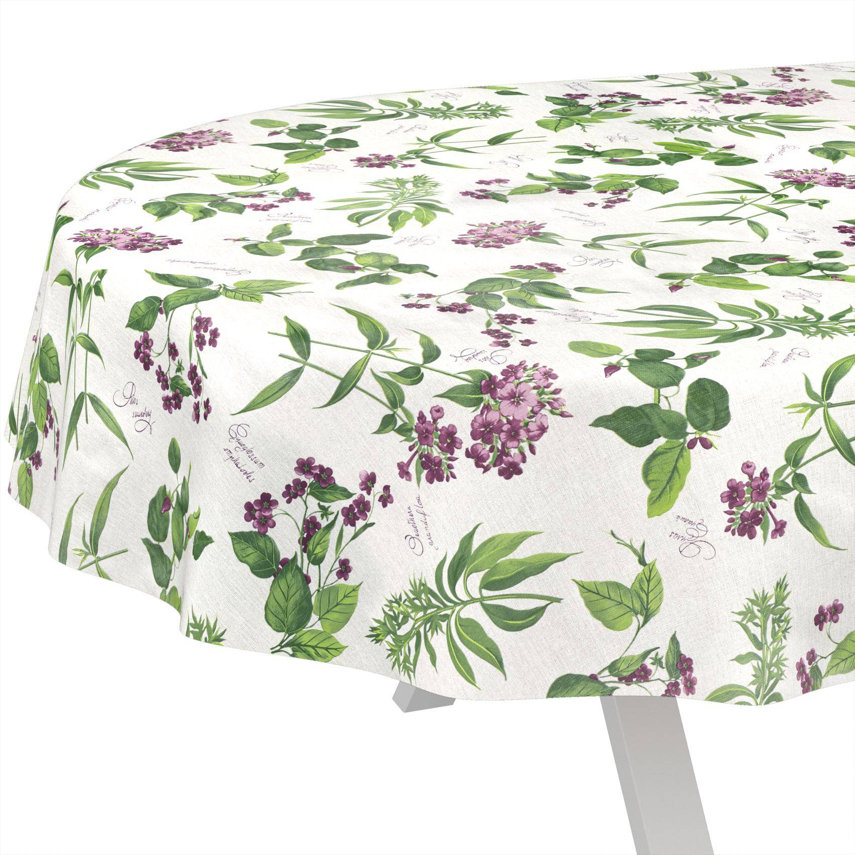 Ein runder Tisch mit einer weißen Tischdecke mit grünem und violettem botanischem Blumenmuster.