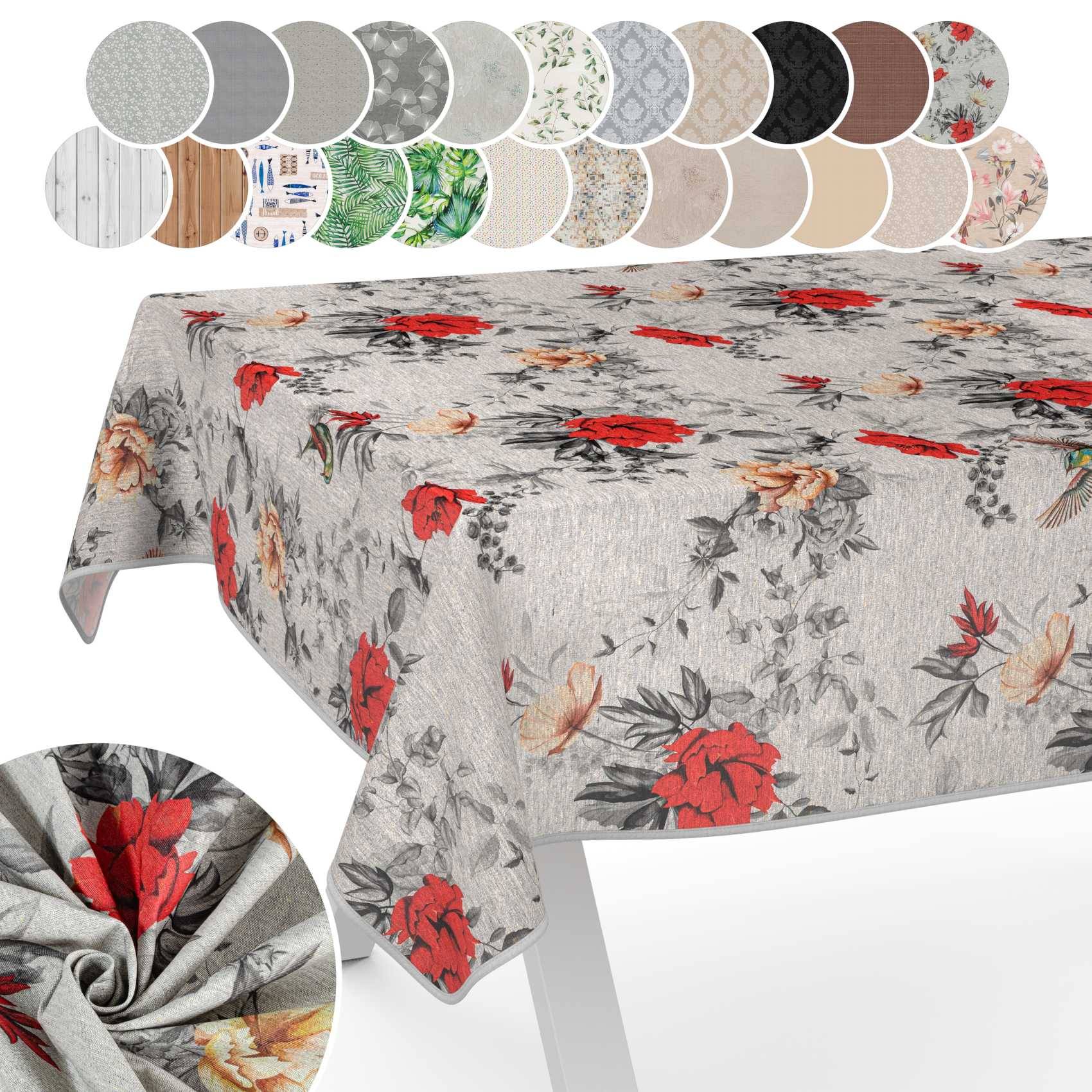 Blumiger Tischdecke auf einem Tisch, gezeigt in grauem Stoff mit roten und beigen Blumendrucken und mehreren Farb-/Mustermustern darüber.
