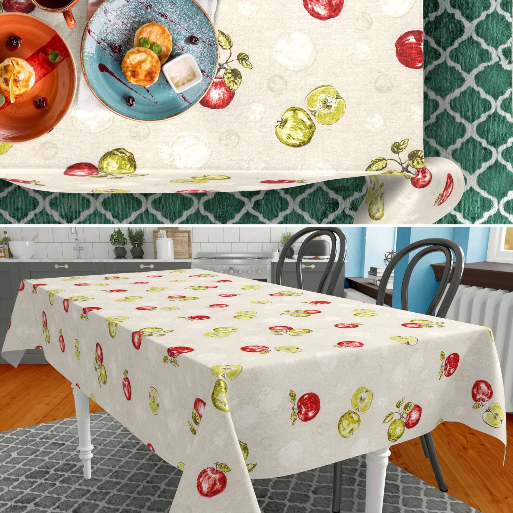 Ein Esstisch mit einer weißen Tischdecke, bedruckt mit roten und grünen Früchten, gezeigt in einer Küche/Esszimmer und in Nahaufnahme.