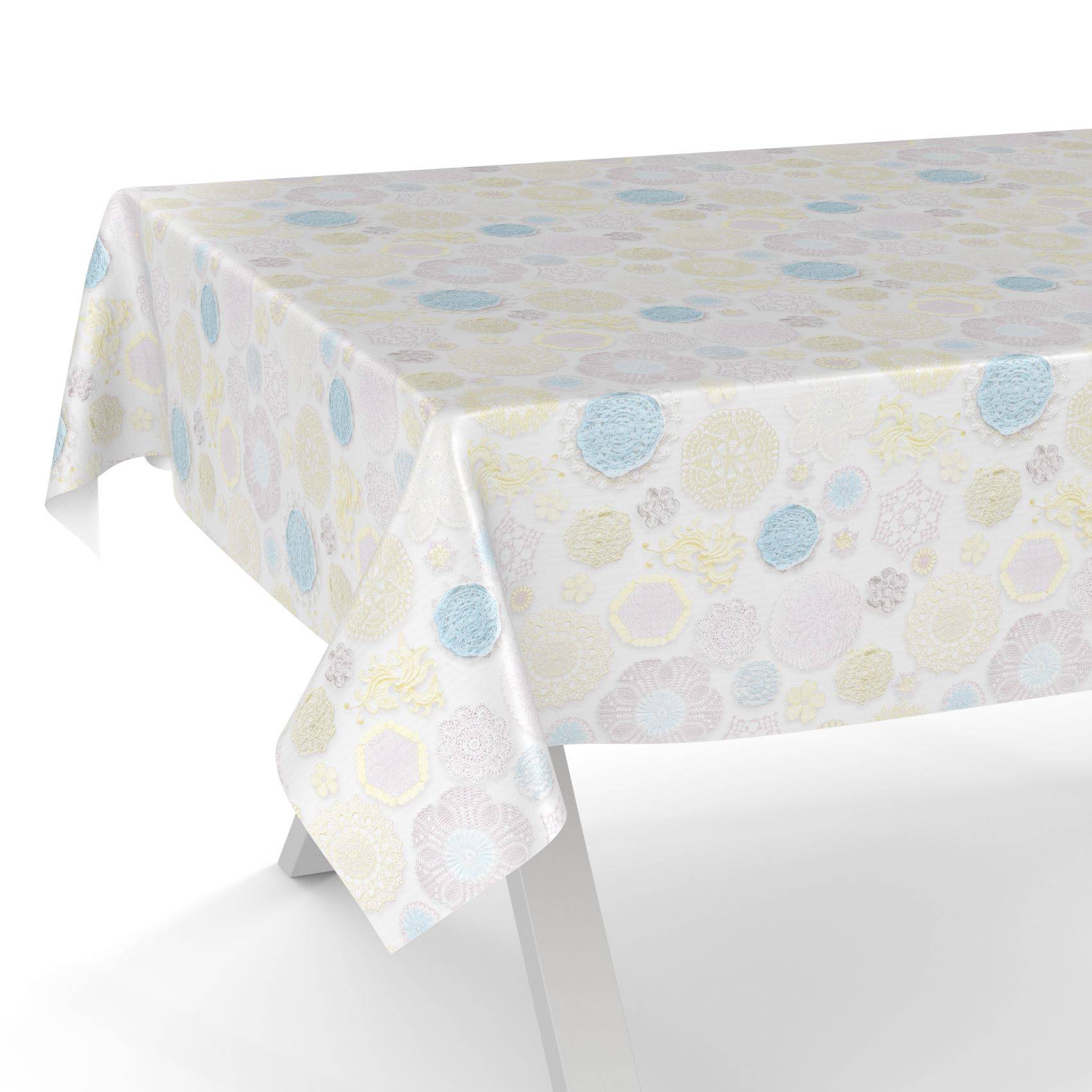 Tisch mit einer weißen gemusterten Tischdecke mit pastellblauen, gelben und grauen Kreismustern