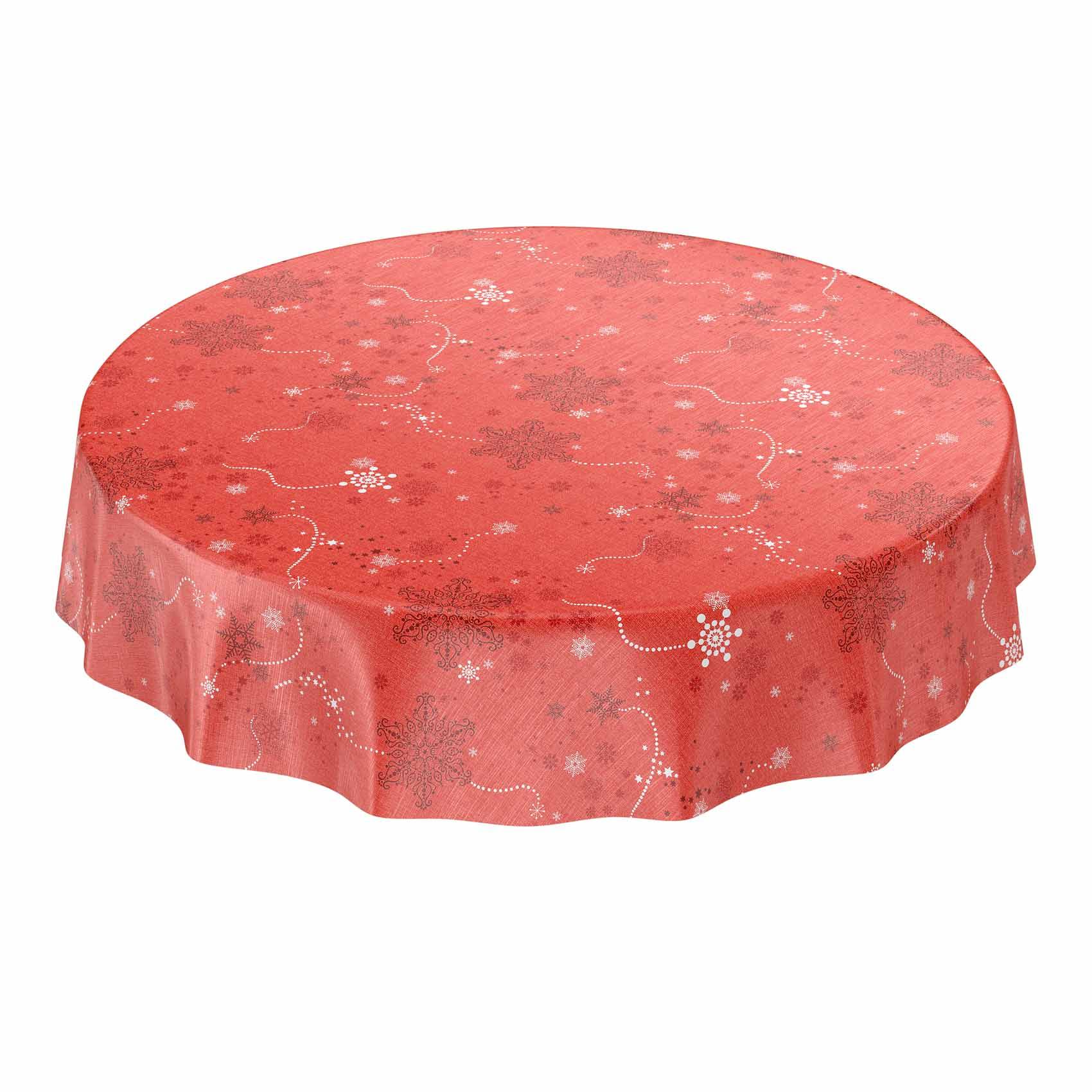 Runder Tisch mit einer roten gemusterten Tischdecke mit subtilen Blumen- und schneeflockenähnlichen Designs.