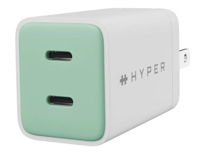 Kompakter USB-Wandladegerät in Weiß und Mintgrün mit zwei vorderen Ladeanschlüssen und ausklappbarem Stecker.