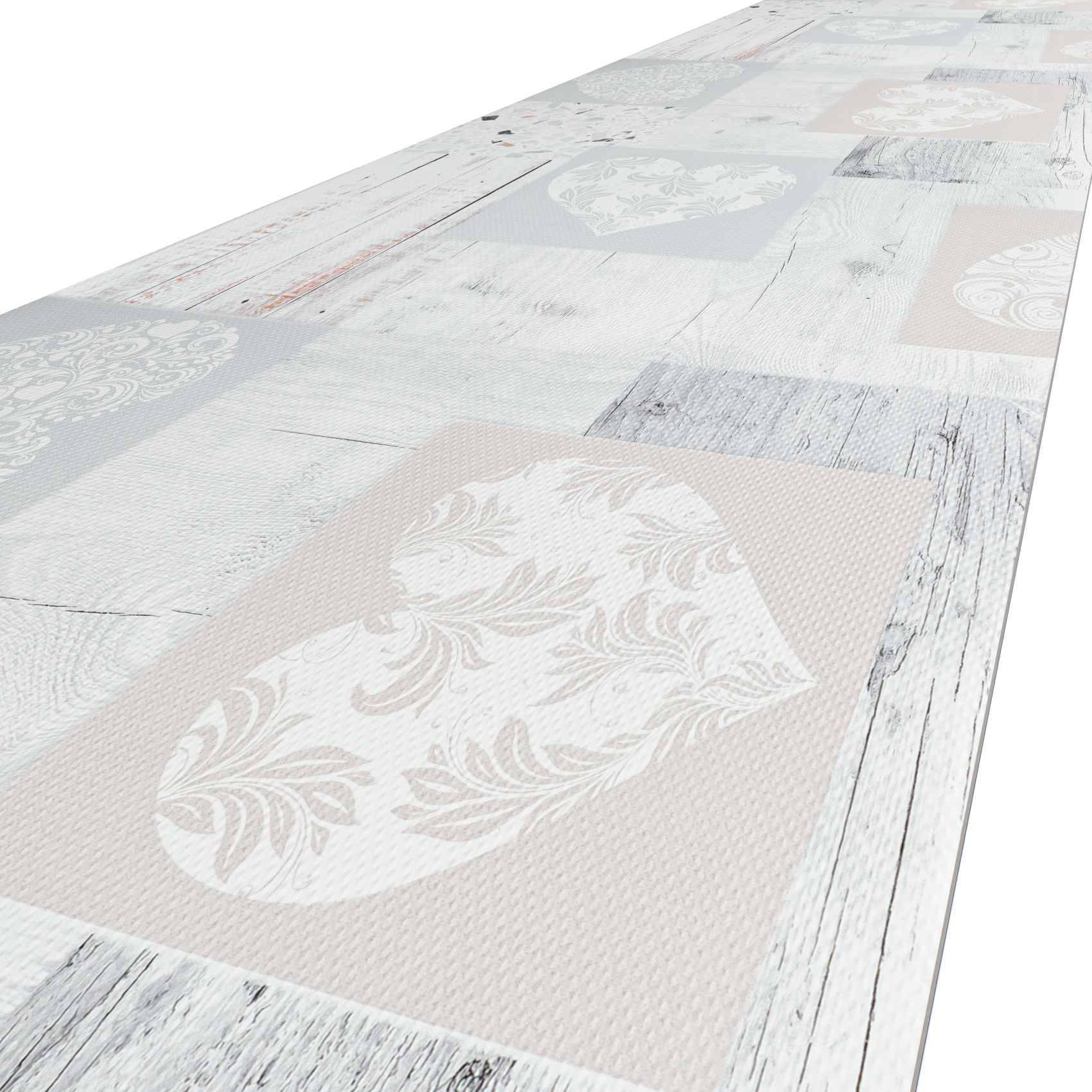 Langer schmaler gemusterter Läufer mit verblichenem pastellfarbenem Patchwork, floralen Medaillons und abgenutzten holzoptik-Kanten auf weißem Hintergrund.