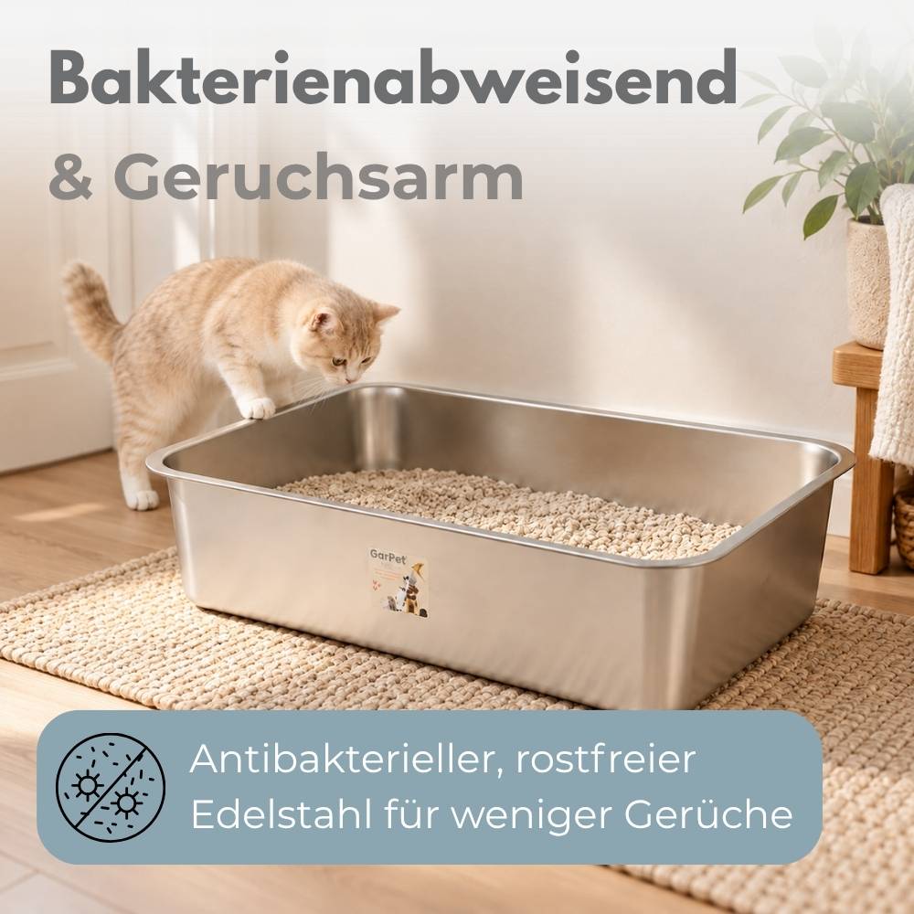 Orangefarbene Katze, die eine Edelstahl-Katzentoilette beschnuppert; deutscher Text sagt „Bakterienabweisend & Geruchsarm" und „Antibakterieller, rostfreier Edelstahl für weniger Gerüche"".