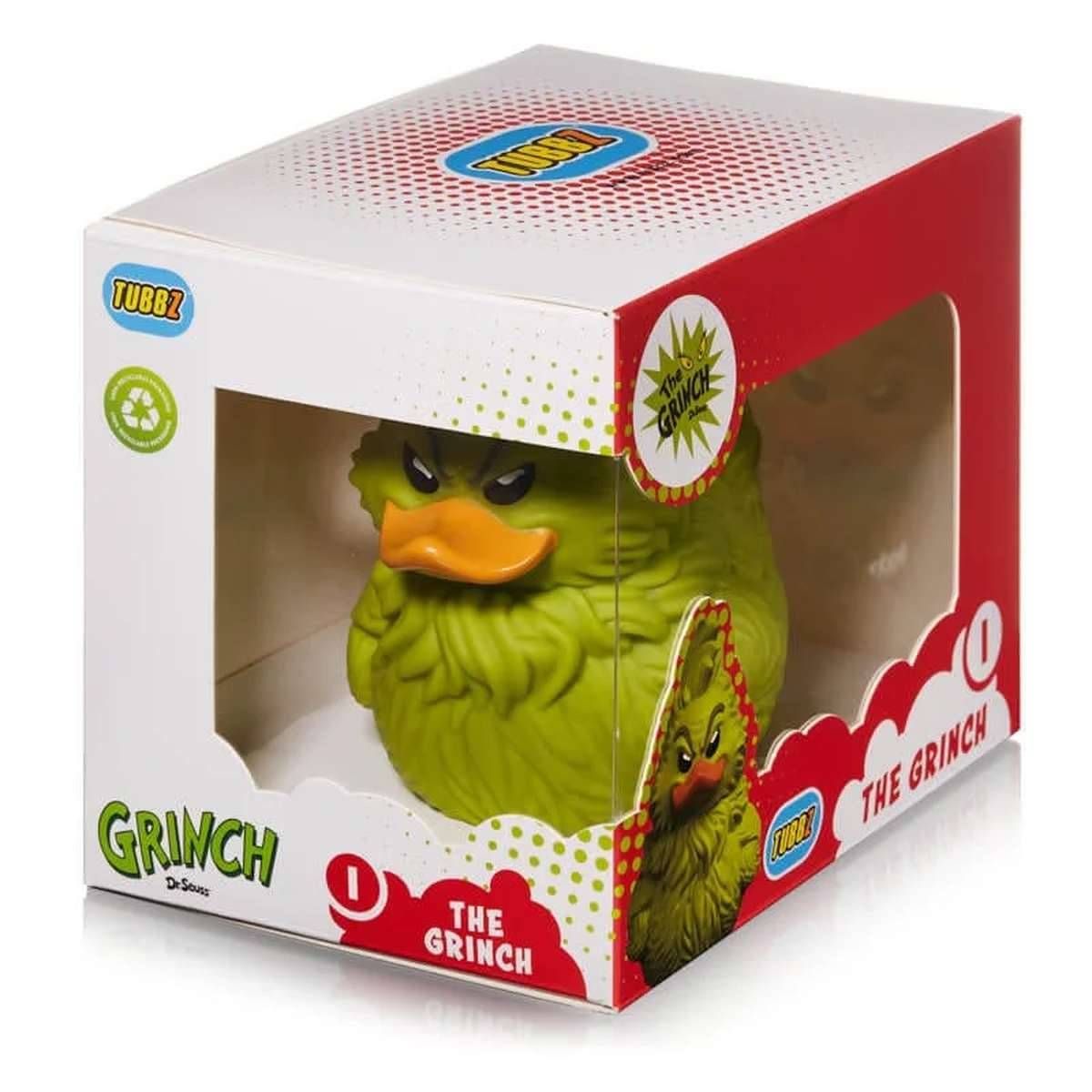 Verpackte Grinch-Charakterfigur in Grün, gezeigt in einer klaren Einzelhandelspacung mit Fenster, beschriftet mit „The Grinch
