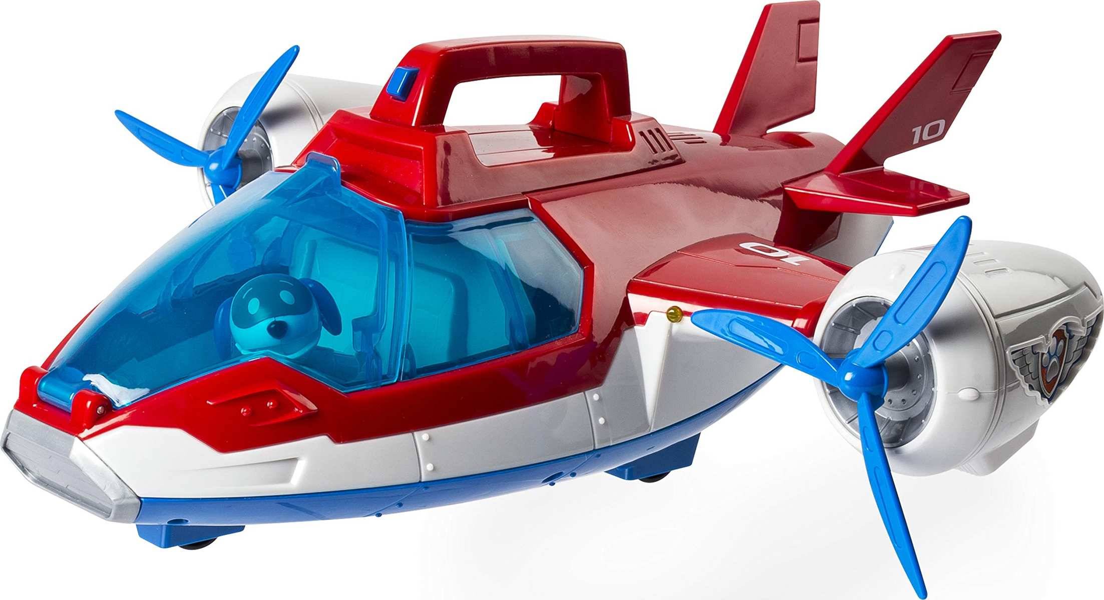 Spielzeugrettungsflugzeug mit blauen sich drehenden Propellern, rot- und silbernem Rumpf und einem transparenten Cockpit mit einer Hundefigur im Inneren.