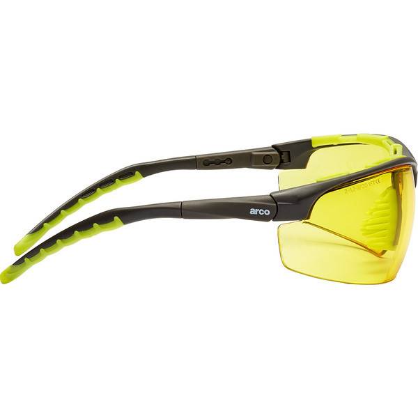 Gelb getönte Schutzbrille mit schwarzem und neongrünem Wraparound-Rahmen, in Seitenansicht auf weißem Hintergrund dargestellt.