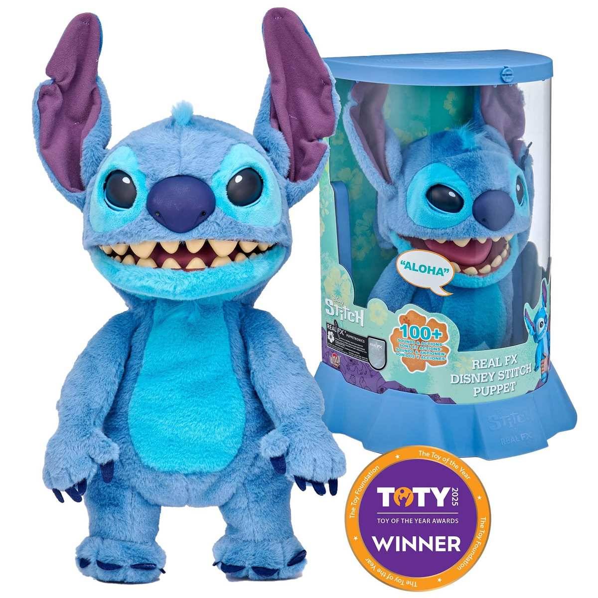 Blue Stitch Plüsch-Handpuppentier mit großen Ohren, abgebildet neben seiner Einzelhandelsbox mit den Aufschriften "ALOHA"", ""100+ Sounds"" und einem Abzeichen ""Toy of the Year Awards WINNER"".