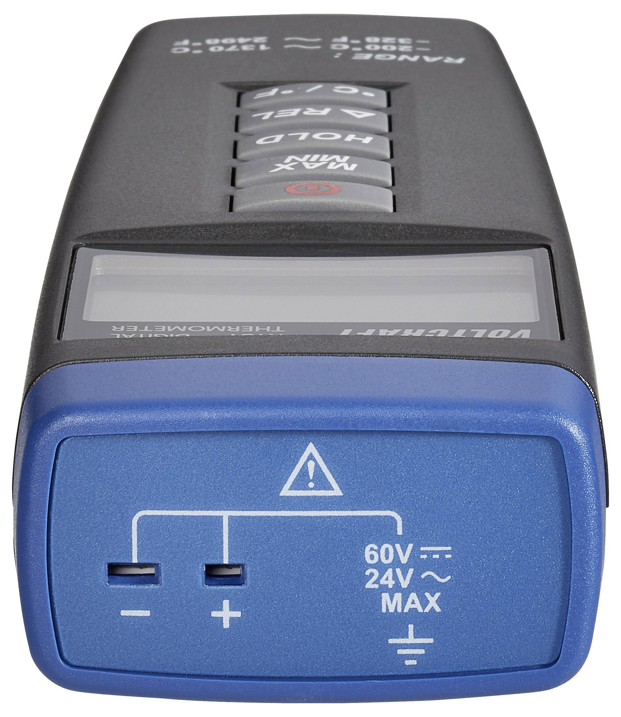 A handheld digital thermometer showing measurement ranges and connection slots on the front for different voltage inputs.