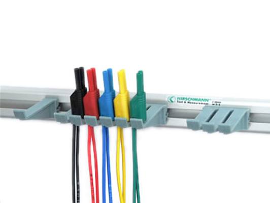Laboratory cable with colour-coded plugs: black, red, blue, yellow, green, mounted on a holder.