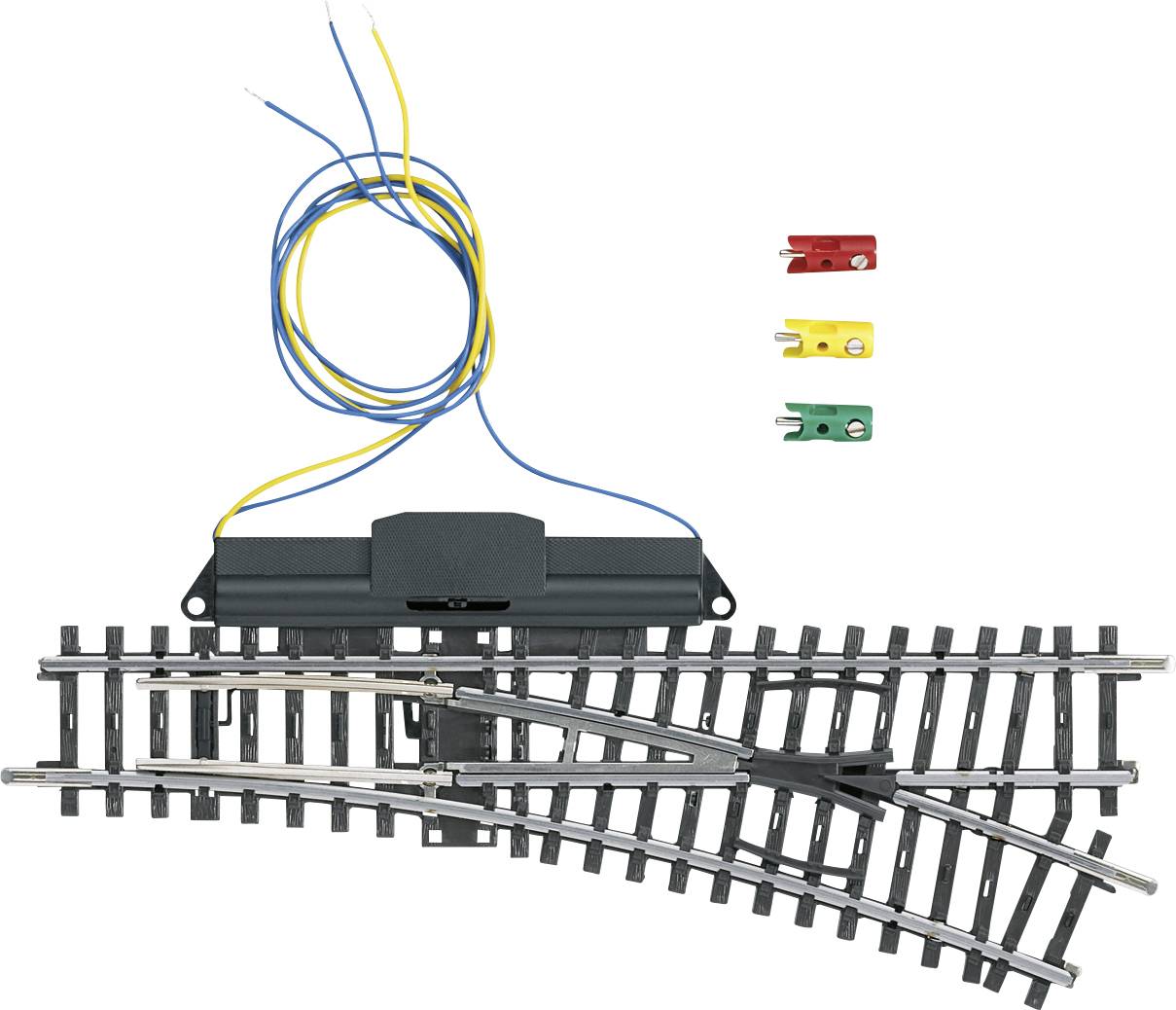 An electric model railway point (or points) with wiring and three cable connectors in red, yellow, and green for controlling the train's direction.