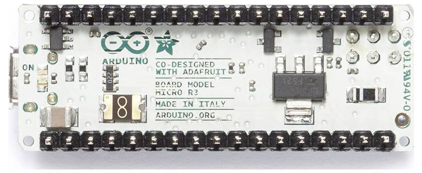 Arduino Nano microcontroller board with USB connector pads, header pins, and printed labels including 'ARDUINO' and 'MADE IN ITALY'.