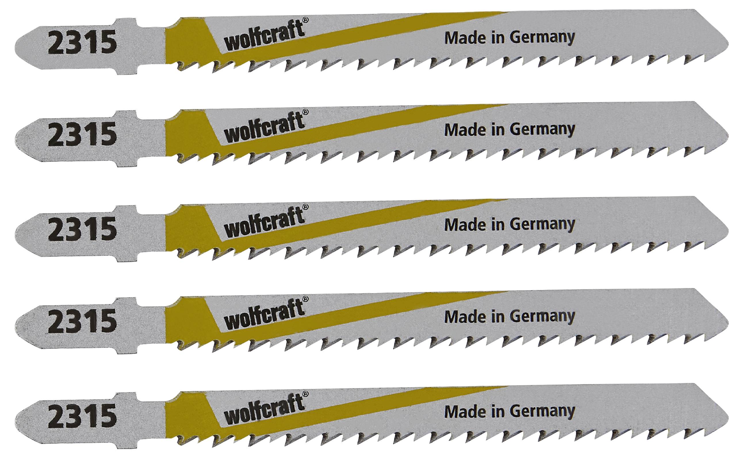 Five jigsaw blades with 'wolfcraft 2315 Made in Germany' printed on them. The blades are silver with a yellow stripe and teeth.