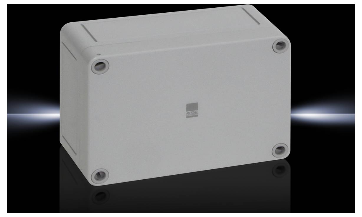 Grey rectangular electrical socket with screws at the corners against a dark background.