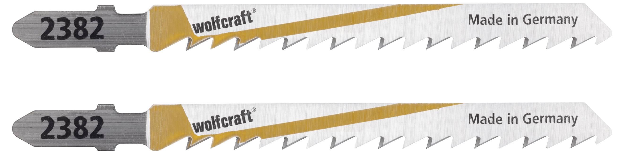 Two metal saw blades by Wolfcraft with the inscription '2382' and 'Made in Germany'. They have a serrated edge.