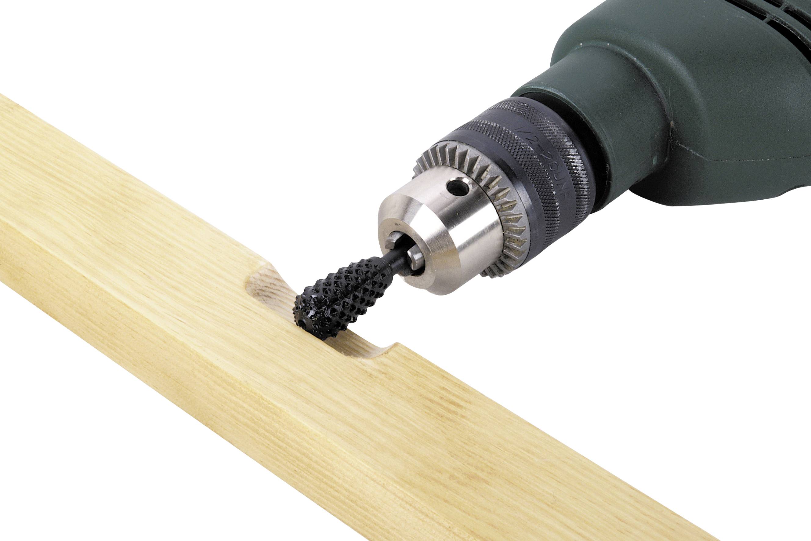 A drill with a grinding attachment is grinding grooves into a piece of wood.