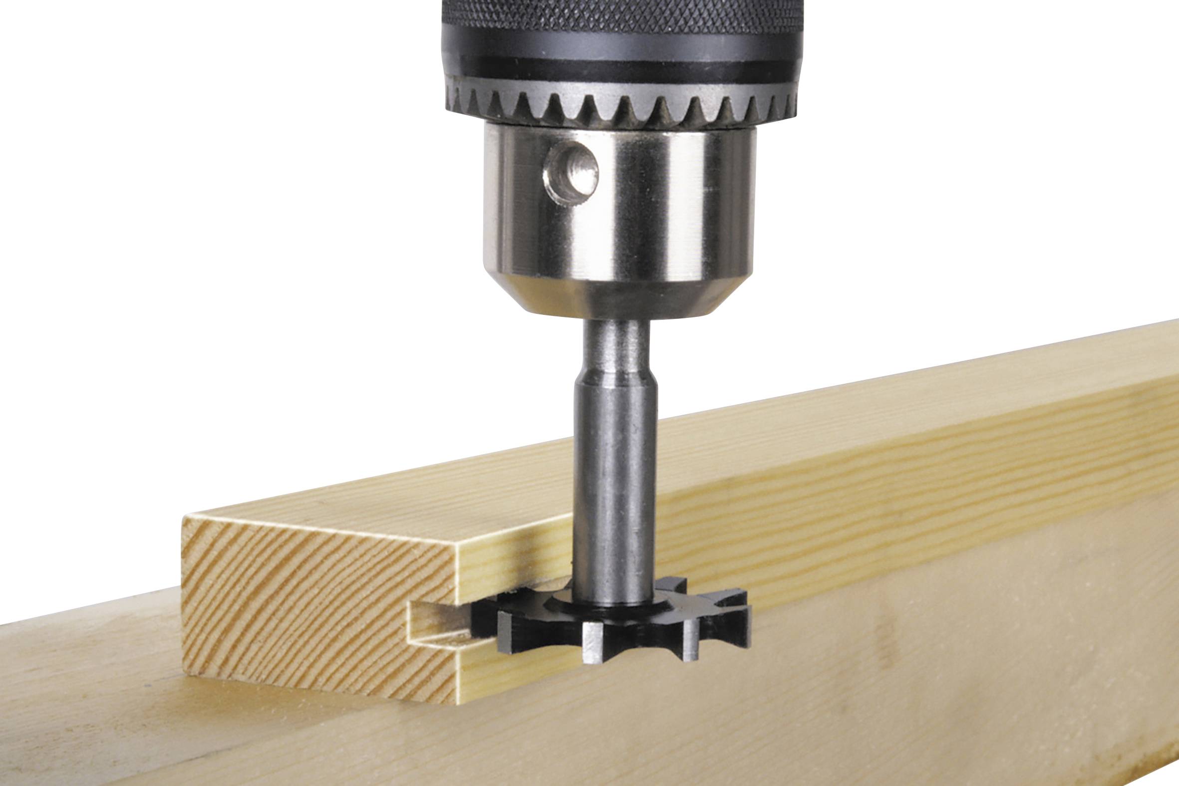 A drill creating a hole in a wooden block demonstrates a precise and controlled cutting process.