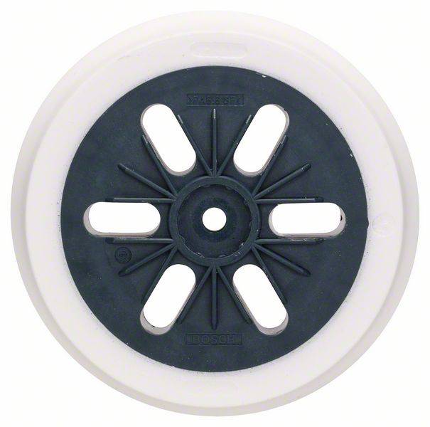 A round, white and grey plastic object with a central opening and radially arranged, open slots.