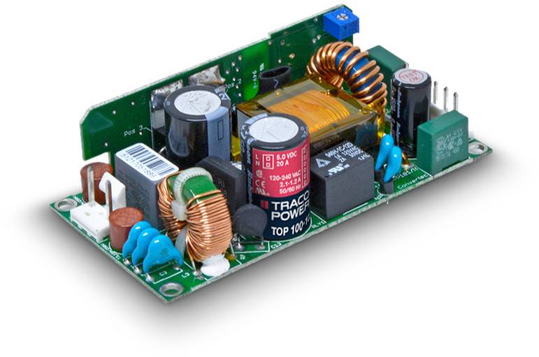 Circuit board of a power supply unit with various electronic components such as inductors, capacitors, and a transformer, on a white background.