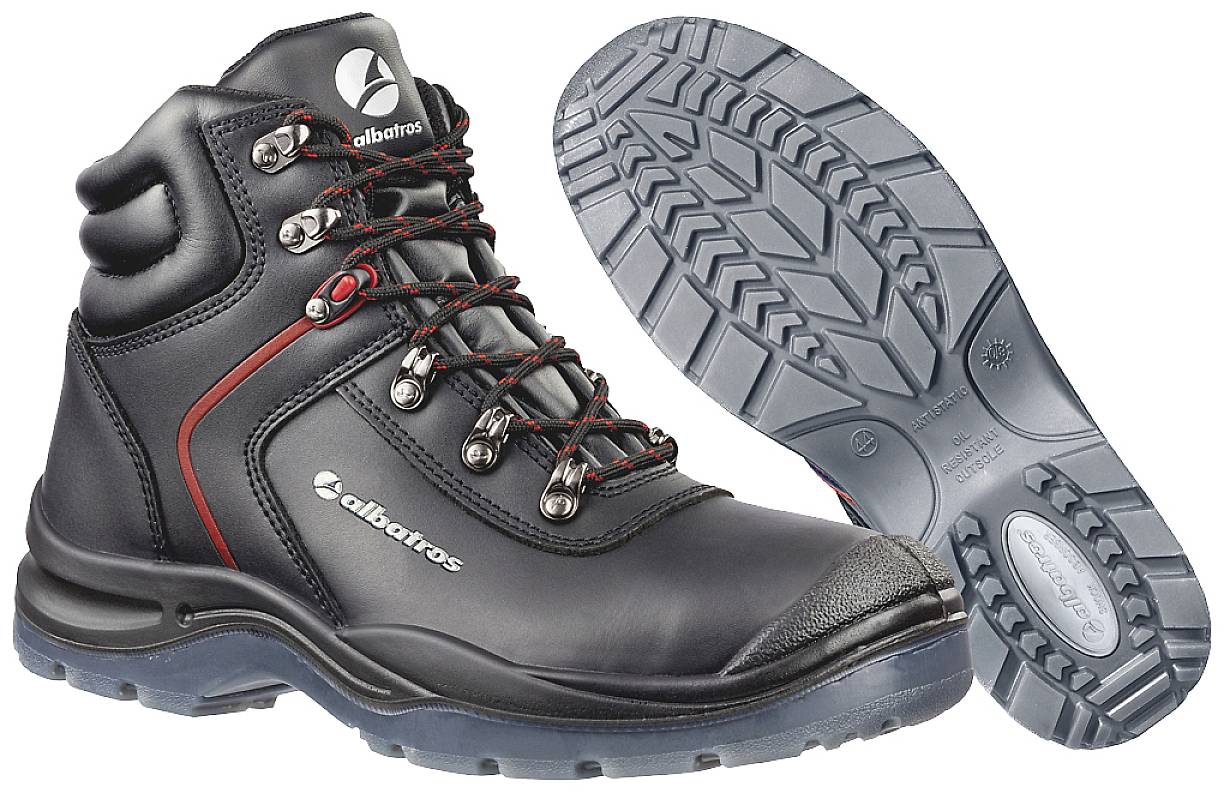 A pair of robust black boots with red accents and non-slip soles, suitable for outdoor activities or work assignments.