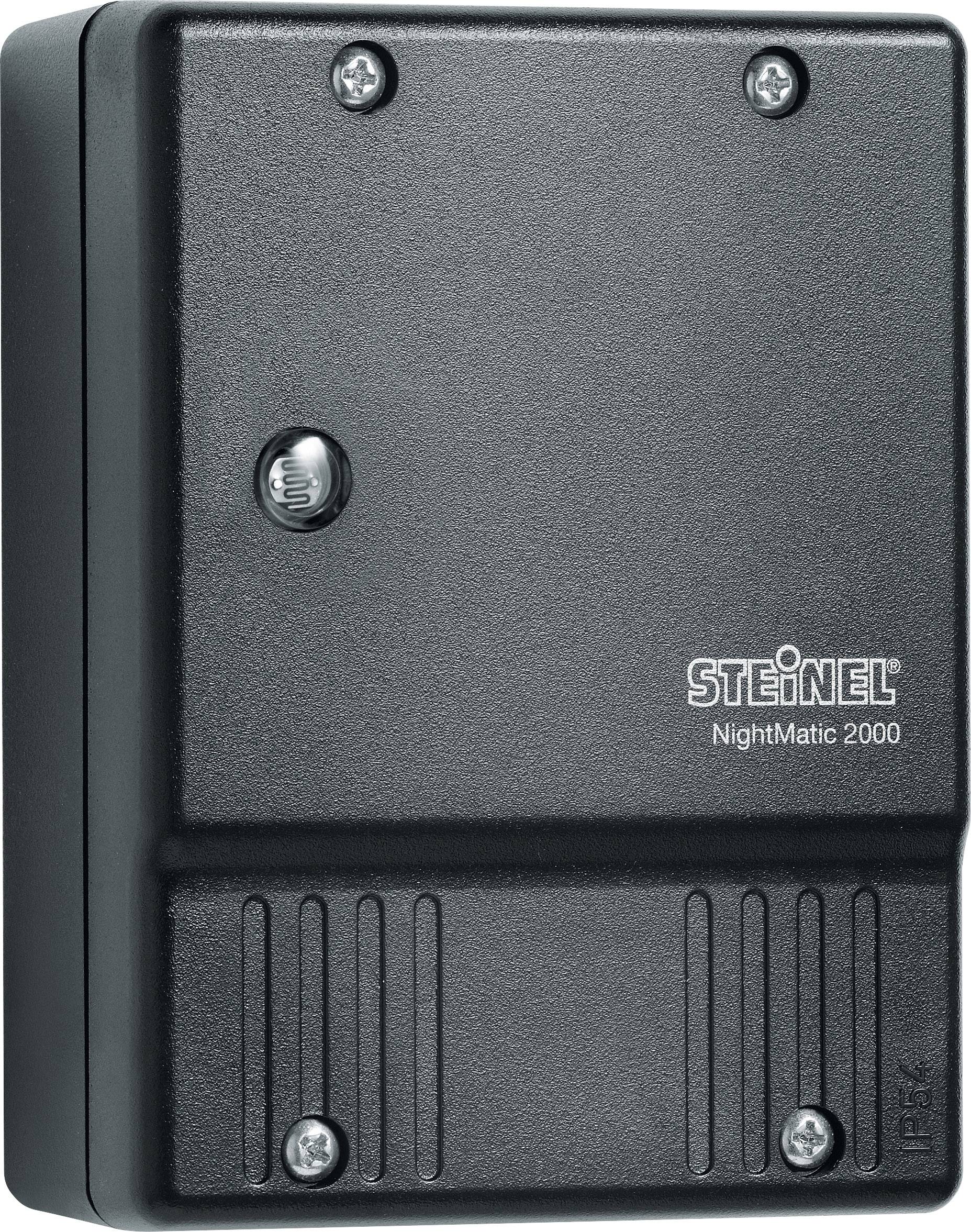 A black light switch with the inscription 'STEINEL NightMatic 2000'. Four mounting screws visible.