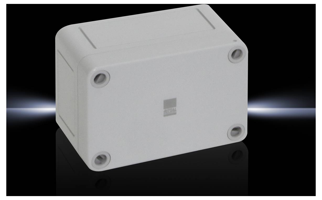 A rectangular, grey enclosure with four screws at the corners, against a black background.