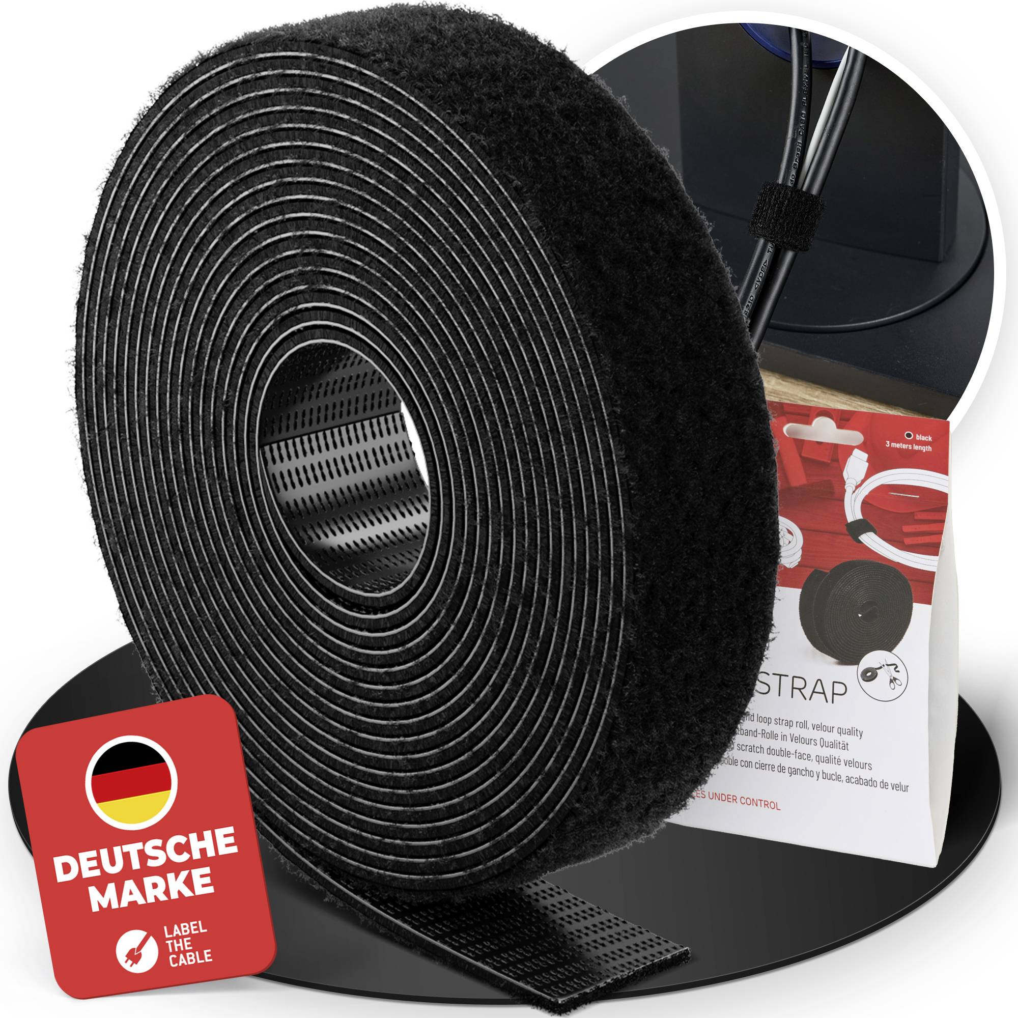 Black adhesive cable strap roll with hook-and-loop fastener, shown with German brand label and packaging on a display base.