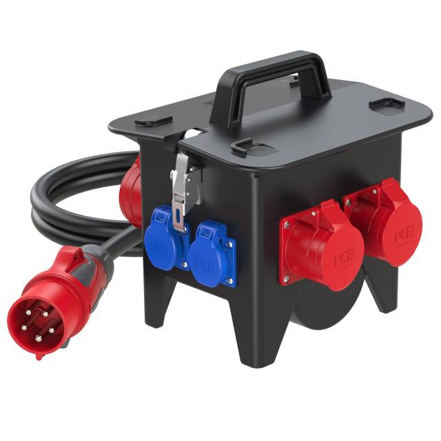 Black extension lead with four red and two blue sockets. Carry handle on top and robust design for outdoor use.