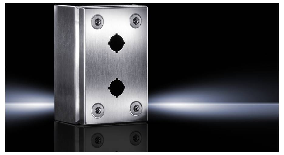 Metal casing with two round recesses and screws, on a black glossy surface with light reflections.