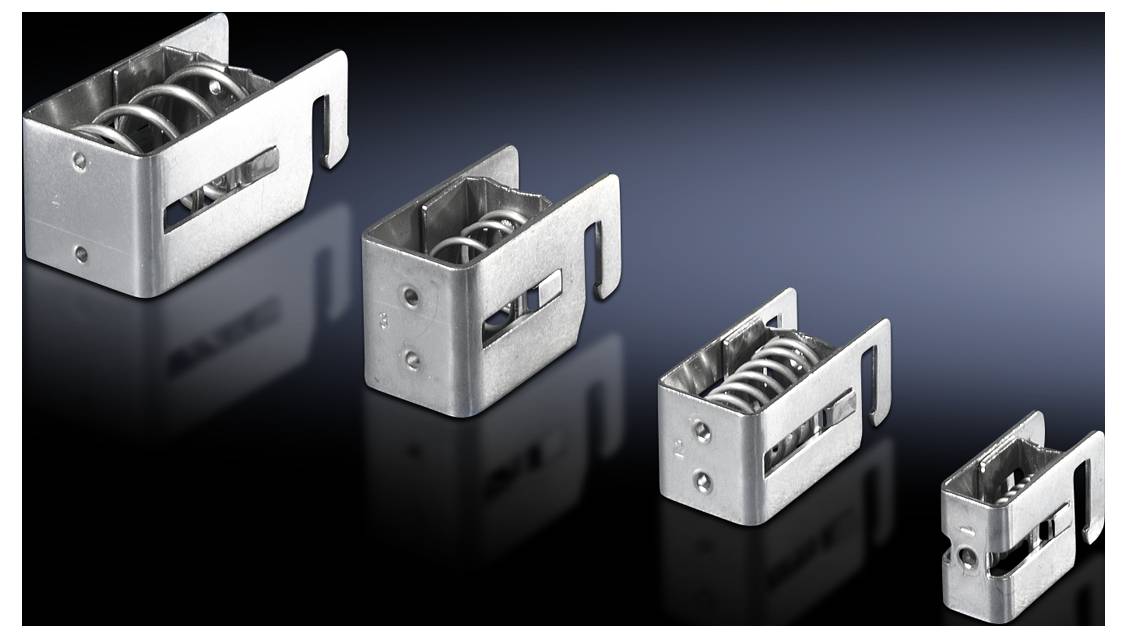 Various sizes of metal clips with integrated spring coil arranged side by side on a black background.