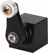 Black mechanical device with screws and metal components, likely part of a larger machinery or electrical system.
