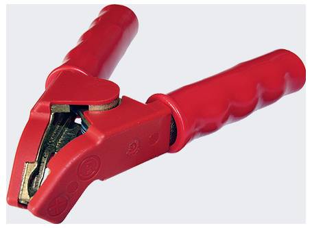 A close-up of a red insulated alligator clip, typically used for electrical connections, showcasing its metal teeth and plastic grip.