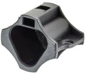 Black, hexagonal plastic component with a large central cavity and multiple smaller openings and mounting points.