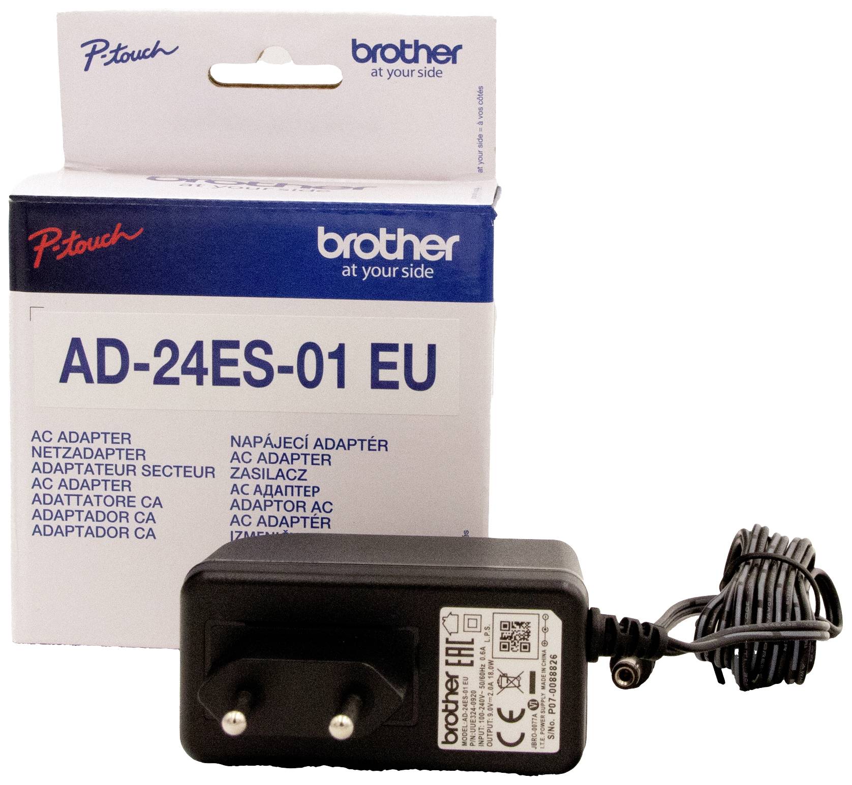 Mains adapter 'AD-24ES-01 EU' by Brother next to its packaging. Suitable as a replacement or spare power supply for compatible devices.