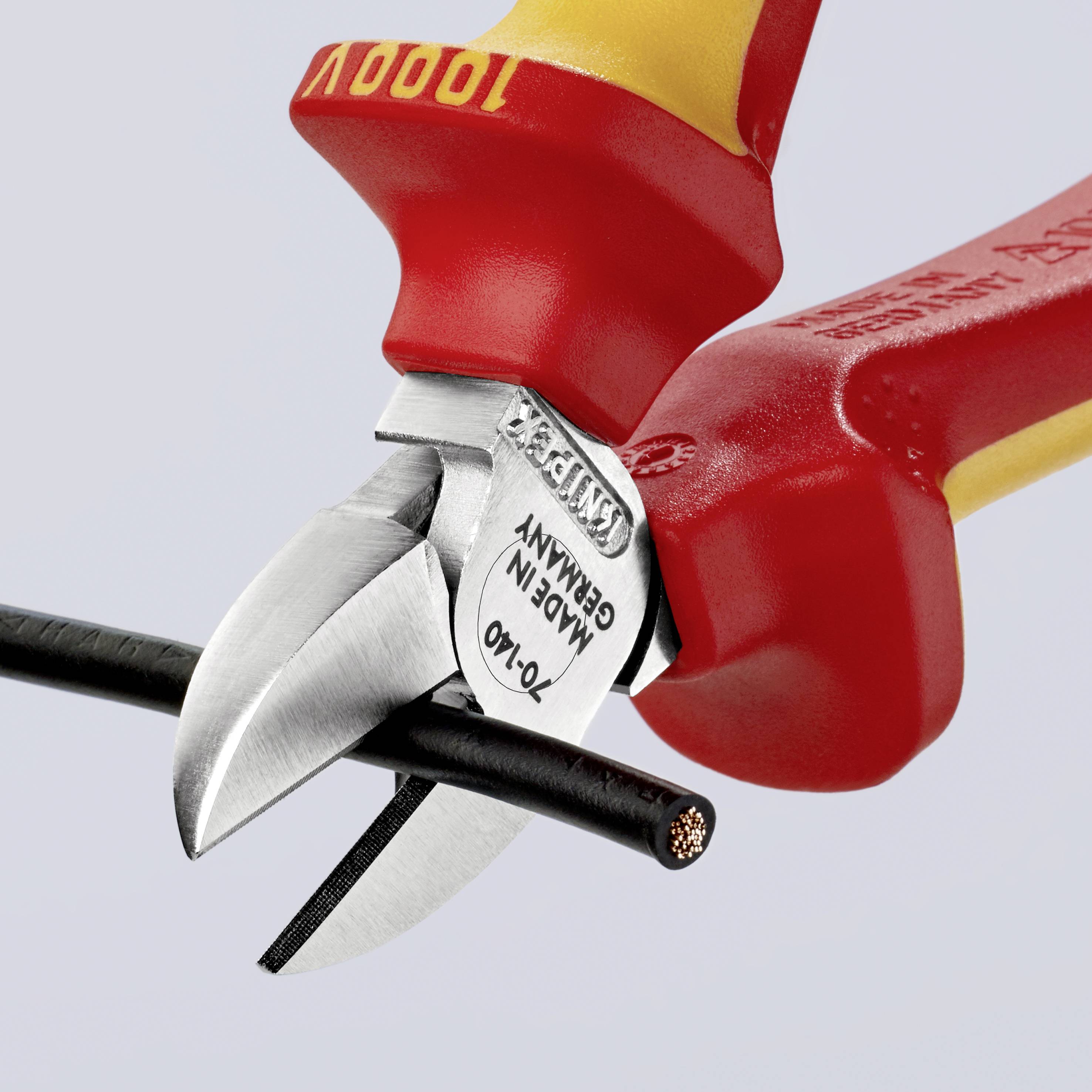 A cable cutter cuts through a black cable. The pliers have the inscriptions '1000V', 'Germany' and 'Made in Germany' visible.