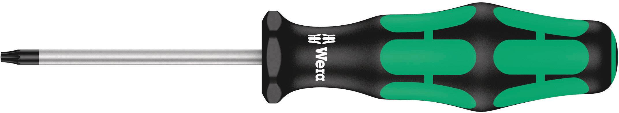 A screwdriver with an ergonomic handle in black and green, lying on its side.