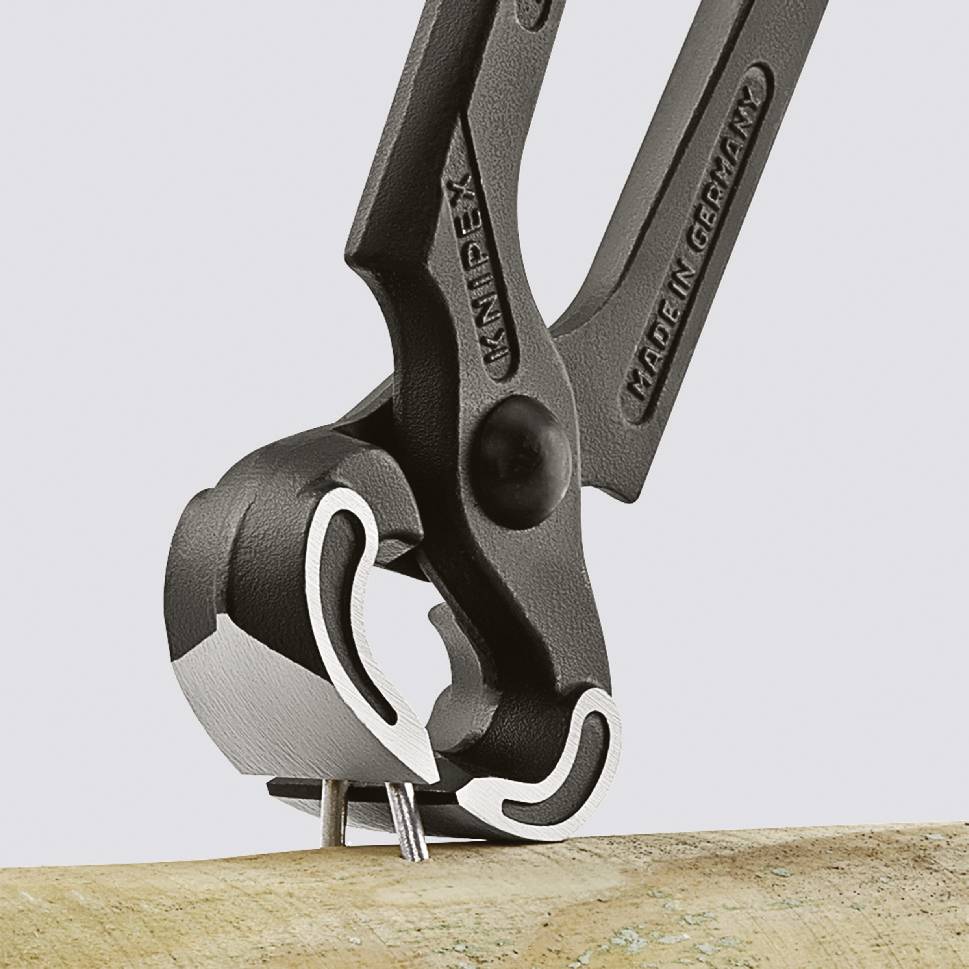 Water pump pliers pulling a single nail from a wooden beam, with the inscription 'MADE IN GERMANY'.