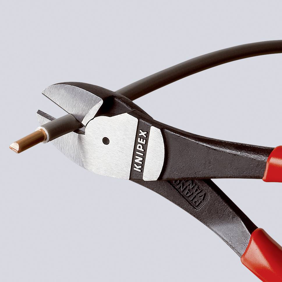 Side cutters slice through a copper cable.