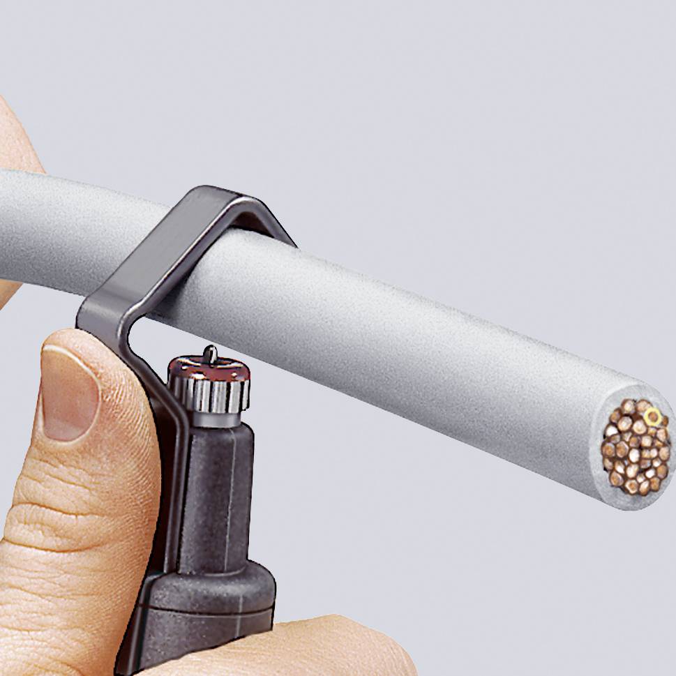 A hand is holding a tool handle hooked onto a grey cable in order to cut or open the cable.