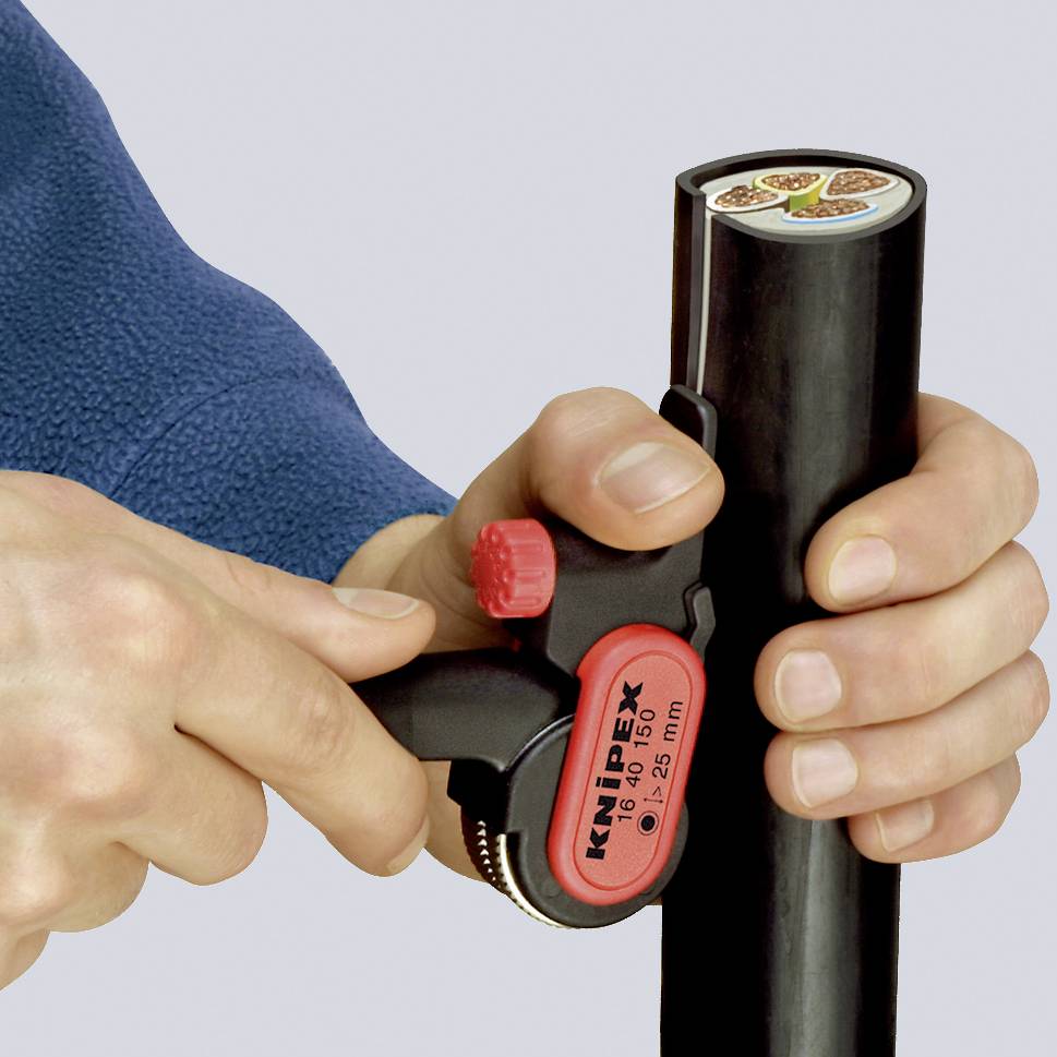 A person is cutting a round black pipe with a pipe cutter. The tool has a red adjustment screw.