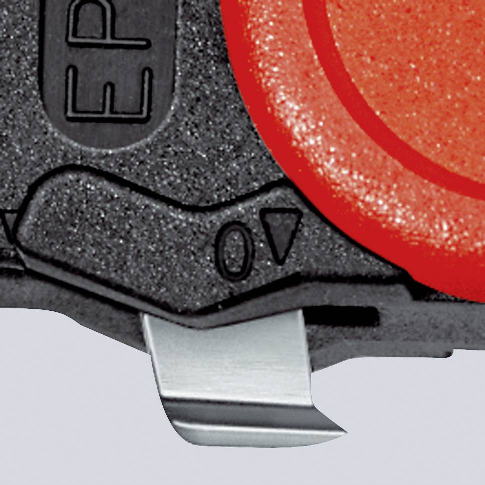 A close-up image shows a red, round button on a black device. The button has a smooth surface.