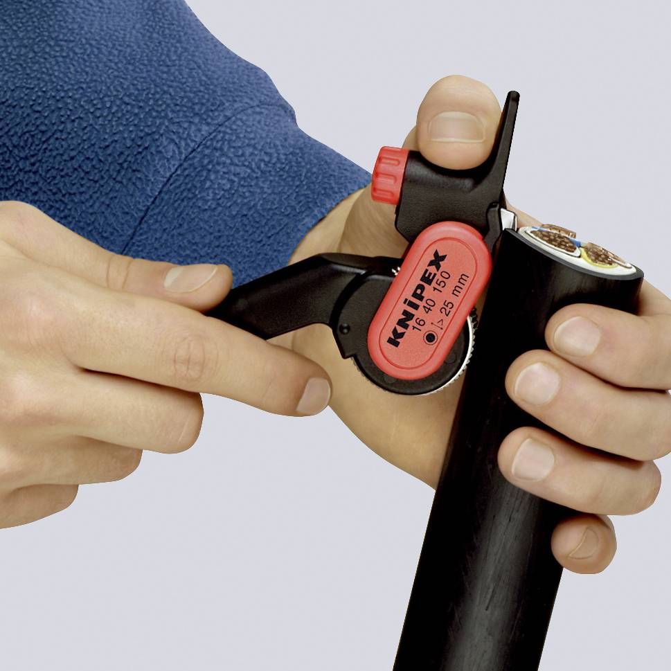 A person is using a wire stripper to precisely strip the insulation from a cable. The tool shows markings for different diameters.
