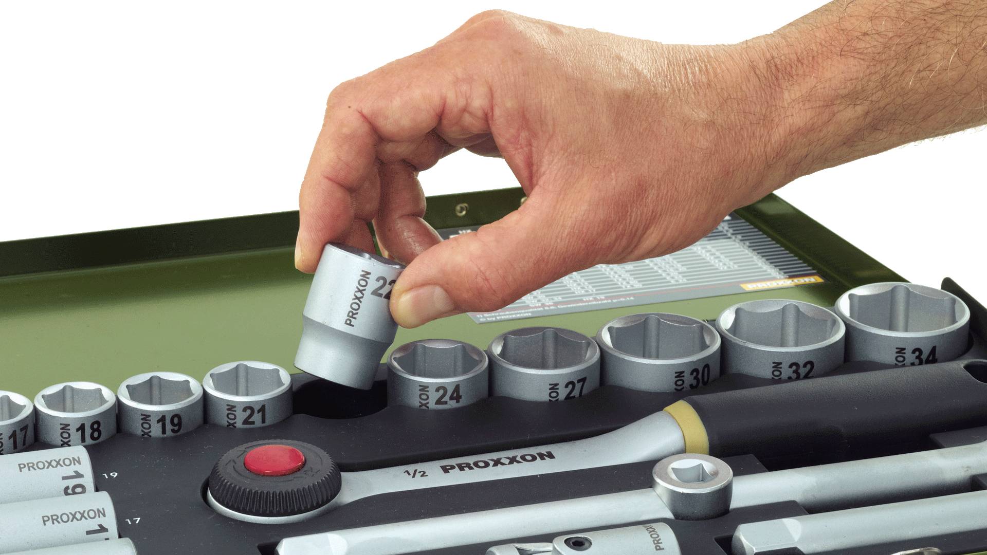 A hand reaches for a socket from a toolbox containing various socket sizes and a ratchet.