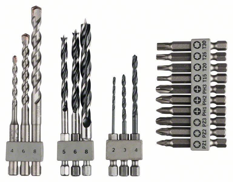 A set of drills and bits in various sizes and types, arranged in an organised row with labelled holders.