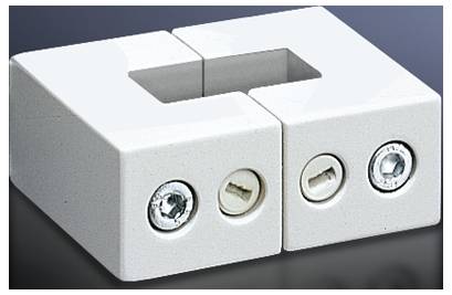 Two white, square mounting clips with integral screws for fastening. They are positioned side by side on a dark surface.