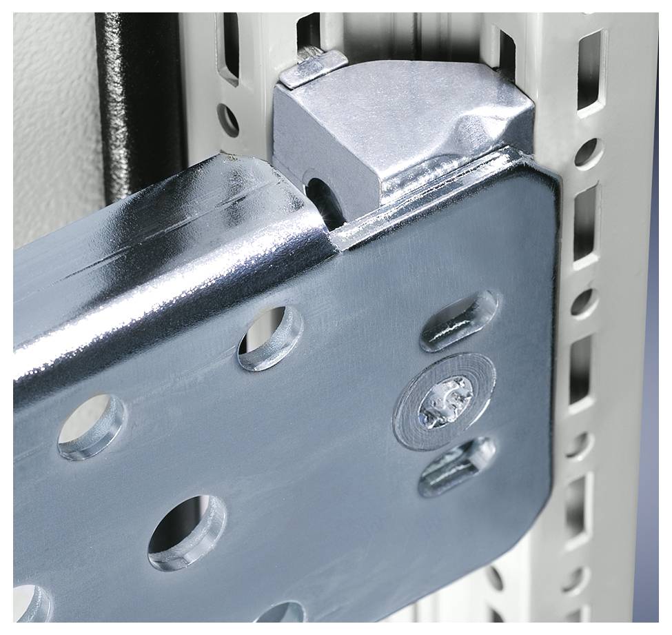 Metal angle is fixed to a perforated shelf bracket. Shows a detailed view of a robust, industrial connection.