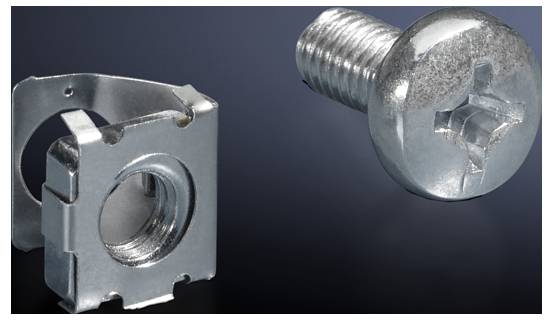 Metal screw and nut on a dark background. Screw has a cross-head.