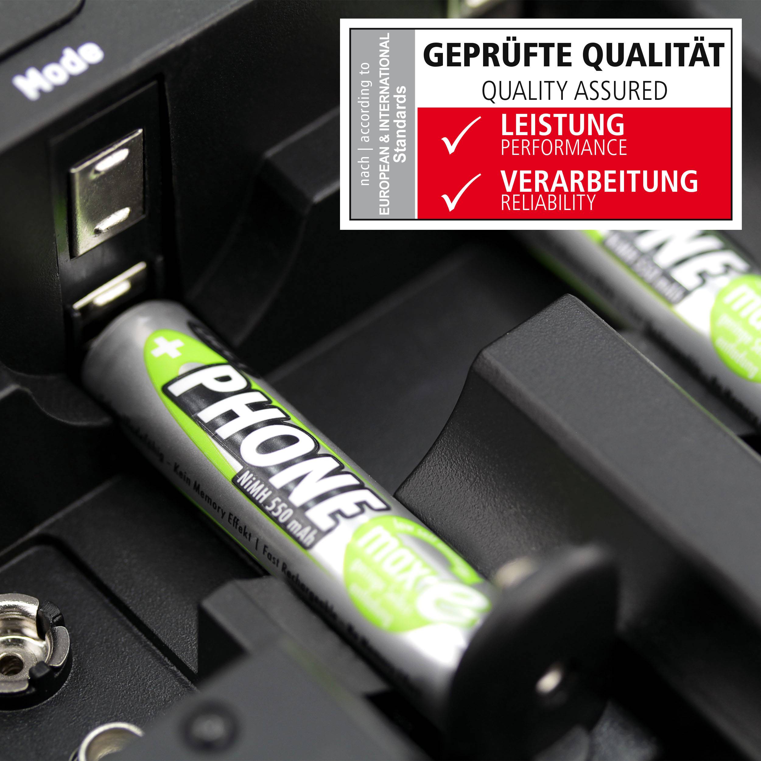 A charger is charging two AA batteries with the label 'PHONE'; next to it a sign reads 'Verified Quality: Performance, Workmanship'.