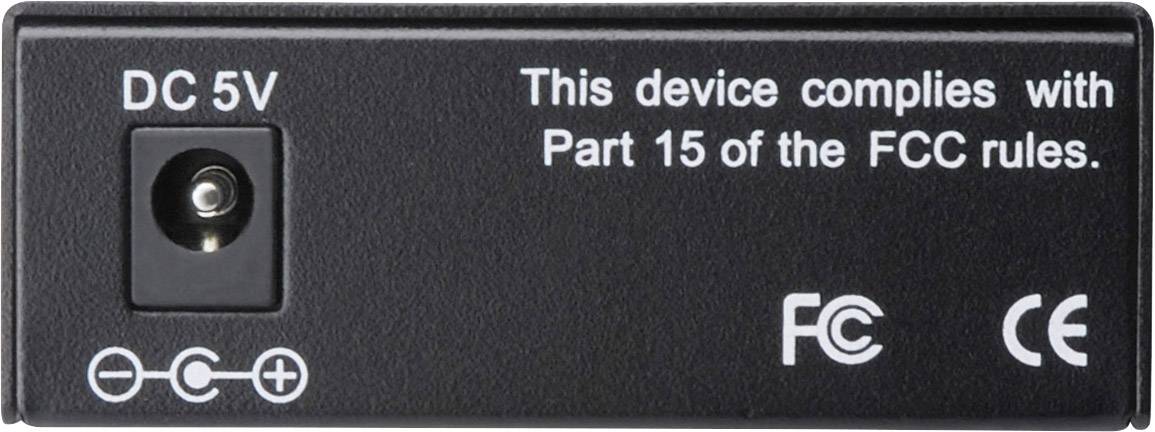 Black power supply with inscription 'DC 5V'. Text: 'This device complies with Part 15 of the FCC rules'. Symbols: FCC, CE.(Note: The translation remains the same as the original text, which is already in English)