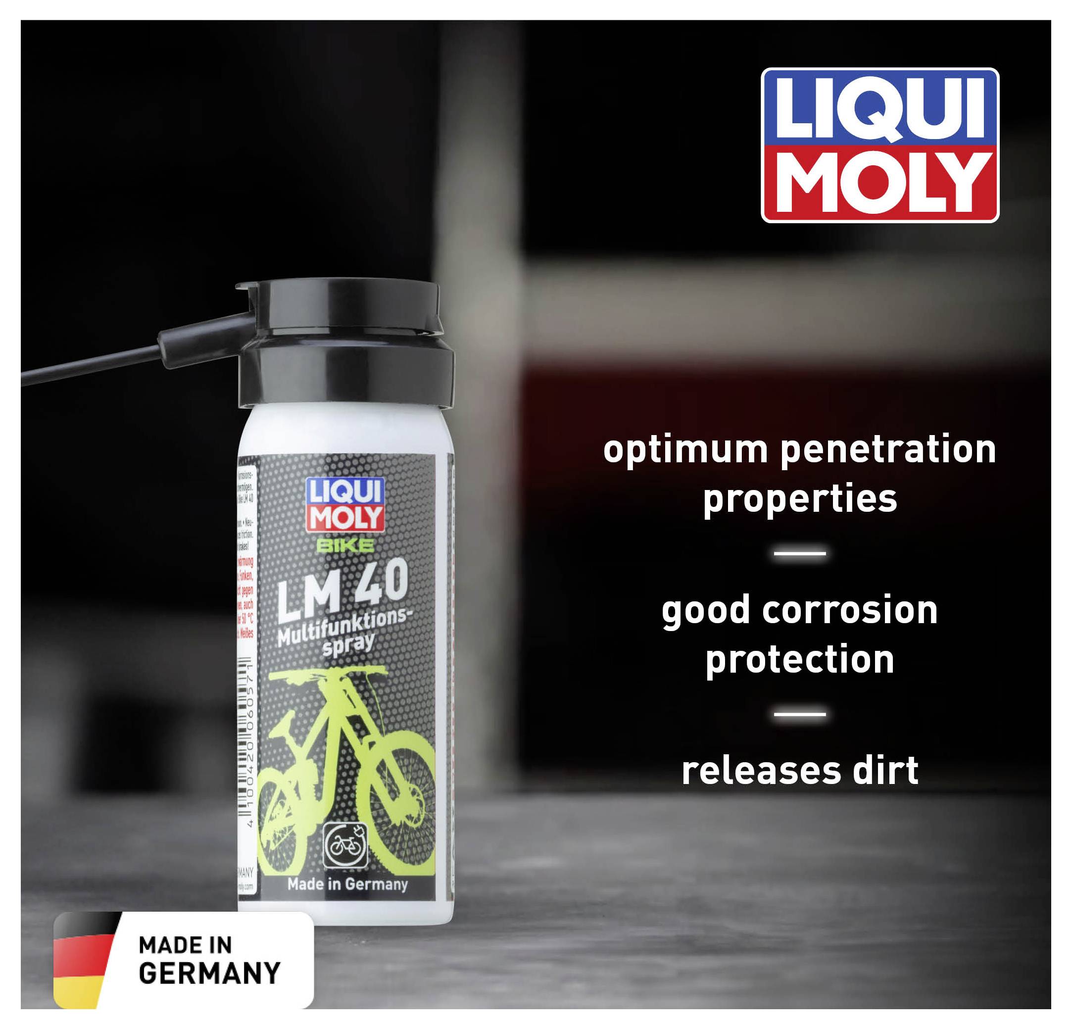 A bottle of LM 40 multi-purpose spray by Liqui Moly sits on a table. The labelling emphasises 'optimal creep performance', 'good corrosion protection' and 'dirt-dissolving'. Made in Germany.